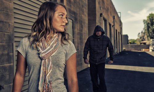 GIRL SELF DEFENSE | A young woman sees a suspicious person walking behind her and plans to defend herself against a male attacker in an alley. Refuse to be a victim.